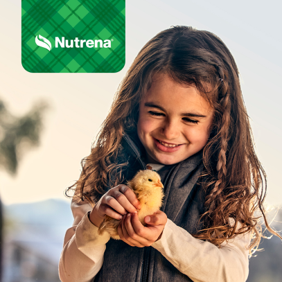 Girl holding chick