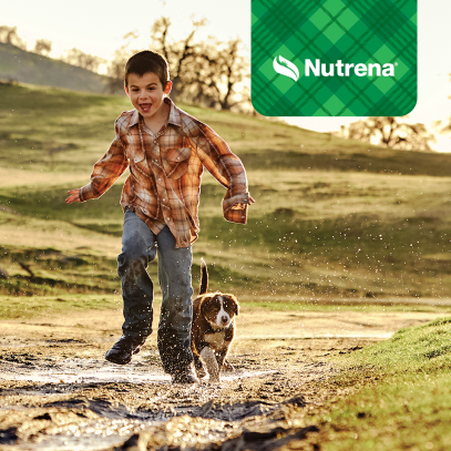 Boy running with dog